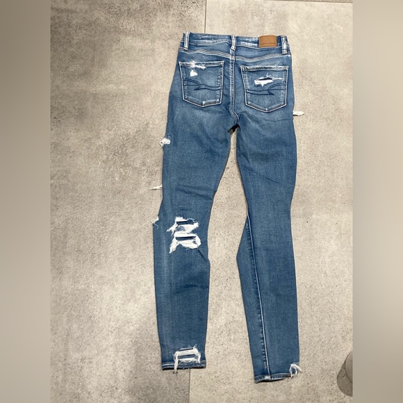 Blue American Eagle High Rise stretchy comfortable jeans. Size 0. - Picture 3 of 3